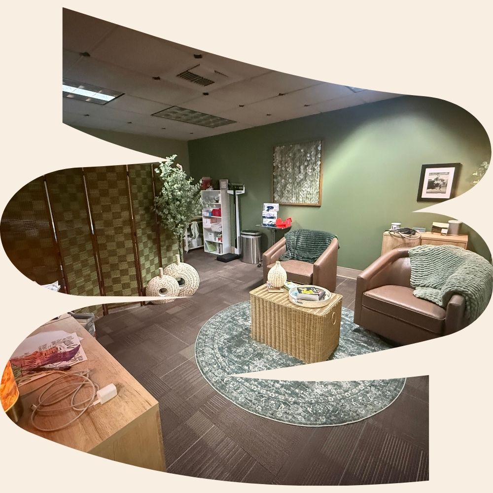 A calm Zoya consultation room with comfortable seating, warm lighting, and a view of evergreen trees outside the window